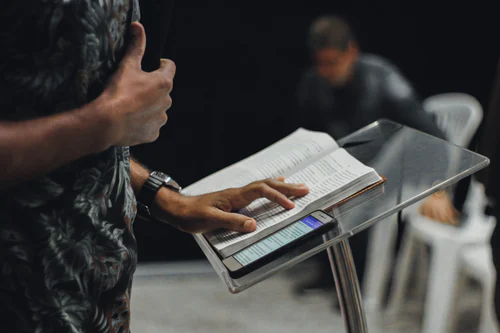 A pastor preaches a sermon.